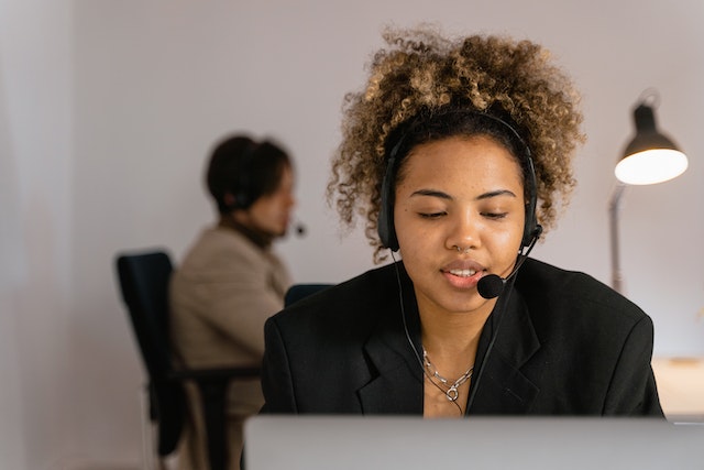young woman talking on the office phone
